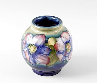 A Moorcroft pottery Clematis pattern vase. Circa 1940s, of spherical form, with tube-lined decoratio