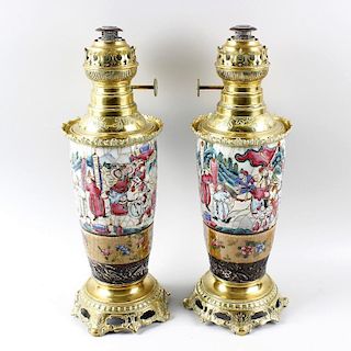 A pair of oriental famille rose crackle ware paraffin lamps, now with brass fittings, over tapering