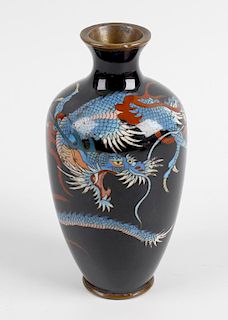 A small cloisonne vase with slender tapered ovoid body finished in a dark blue coloured ground decor