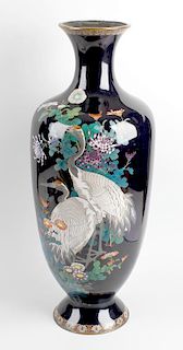 A good large Japanese Meiji period cloisonne vase. Of ovoid form with tall flared neck and footed ba