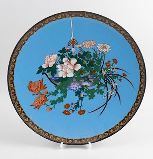 A large Japanese cloisonne charger, the blue coloured ground decorated with a basket of hanging flow