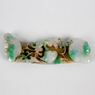 A carved jade handle or scroll-weight Modelled with assorted fruit amidst scrollwork, of pale celado