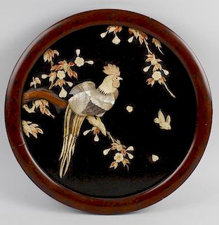 A pair of shibayama circular black lacquered wall panels, with applied mother of pearl decoration de