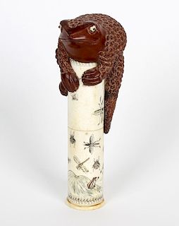 A Japanese bone scroll holder. Of cylindrical form having incised decoration depicting insects and w