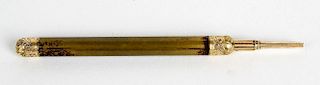 A gilt metal propelling pencil, the cylindrical barrel having foliate engraved mounts, 4 (10 cm) lon