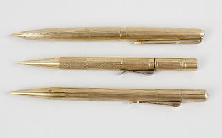 Three 9ct gold mechanical pencils. Comprising a Sampson Mordan & Co. example, a Parker, plus another