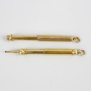 Two Sampson Mordan & Co. yellow metal retractable pencils. The first of plain telescopic form with e