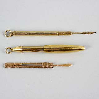 An 18ct gold retractable pencil of plain ovoid form, plus a toothpick within plain cylindrical outer