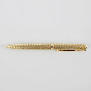 An 18ct gold Parker propelling pencil, having zig zag engine turned textured body and twist mechanis