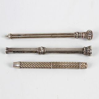 Three silver propelling pencils. The first by Sampson Mordan, with plaited barrel and twist action,