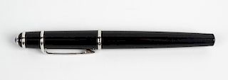 A Cartier Diabolo fountain pen. The black resin body having silvered banding and clip, with blue gem