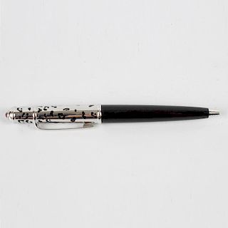 A Cartier ballpoint pen, the black resin lower body with pierced silvered cap, 4.52 (11.5cm) long, i