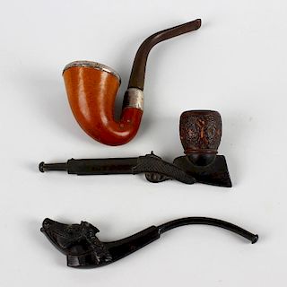 Three assorted pipes. Comprising two novelty examples carved as a rifle and a horse's head respectiv