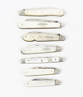 Six silver bladed fruit knives, each with a hallmarked folding blade and mother of pearl veneered ha