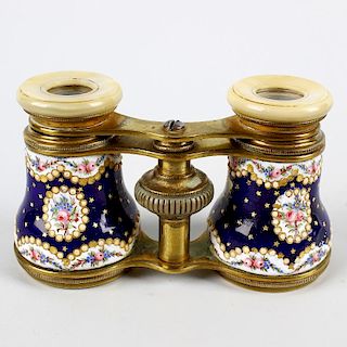 A good pair of French Palais Royal-type enamelled opera glasses. The mother of pearl eyepieces on ex