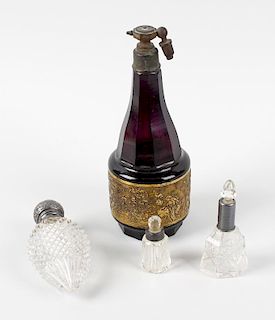 A selection of cut glass scent bottles. To include a cut glass scent bottle with hinged opening cove