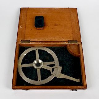An oak-cased surveying dial by Stanley of London. Circa 1900, the four-spoke wheel marked for 360 de