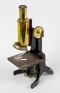 A J. Swift & Son brass microscope. Having rack and pinion coarse and fine adjustment above a rectang