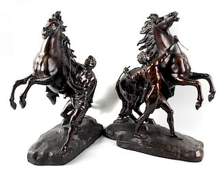 A pair of 19th century bronze Marly horses In the manner of Coustou, each rearing horse with attenda