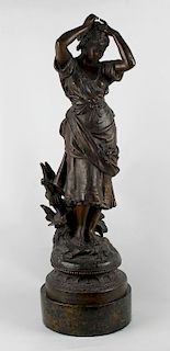 A large spelter figure Circa 1900, modelled as a maiden arranging flowers in her hair, cast 'M.M.S 8