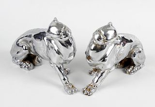 A pair of Art Deco style cast metal panthers, in seated position, 7 (17.75cm). (2). <br><br>Slight r