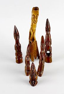 A good group of African patinated ivory figures Probably Lega, Congo, 19th century Comprising nine f