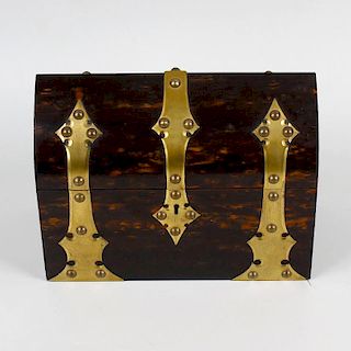 A coromandel stationary box. Having plain brass strap work to the exterior, the lancet arched hinged