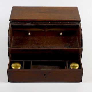 An early 19th century mahogany tambour-front writing box. In the form of a miniature bureau top with