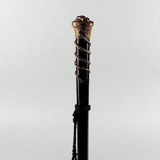 A 19th century gilt metal-topped treen walking stick or cane. The mushroom top with a relief mask ov