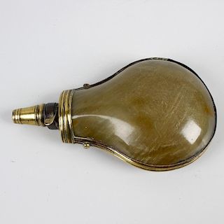 A late Georgian brass-mounted horn powder-flask. Of teardrop form with brass nozzle and seams, 6.75,