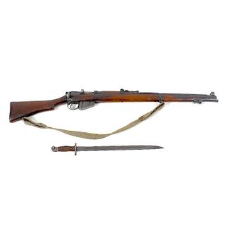 A deactivated S.M.L.E Lee Enfield No 1 MK 3, 303 rifle, with wooden stock and canvas carry strap, to