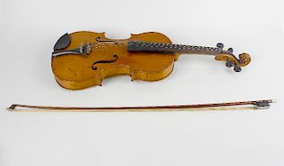 An early 20th century inlaid violin. The reverse having mother-of-pearl inlaid interlocking motif, a