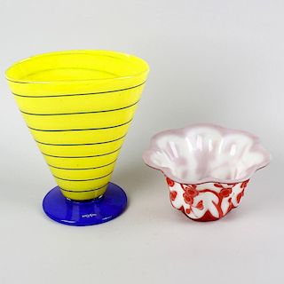 A box of assorted glass ware. To include a Kosta Boda yellow and blue glass trumpet vase, a Chinese