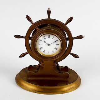 A late 19th century gilt brass novelty ship's wheel desk clock. The 2.25-inch white Roman dial with