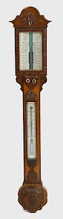 A late Victorian carved oak stick barometer Hill, Birmingham The break-arched and flowerhead-carved