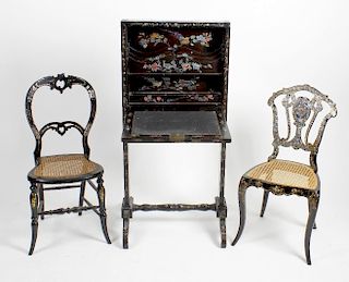 An unusual oriental black lacquered and mother-of-pearl inlaid folding desk, the hinged fall panel f