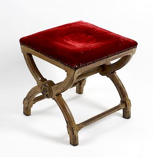 A Victorian Gothic revival oak X-frame stool, in the manner of A.W.N Pugin, with padded plush covere