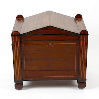A George IV inlaid mahogany cellaret, possibly Scottish. The hinged pedimented top, having boxwood s