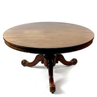 A mid 19th century mahogany breakfast or centre table. The three-piece circular tilting snap top on