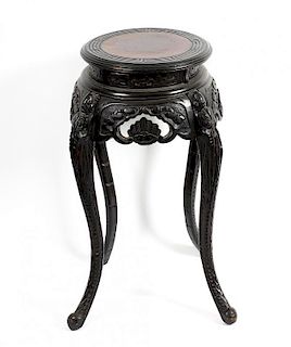 A Chinese carved stained pine vase stand The circular top with greek key border on scroll-carved fri