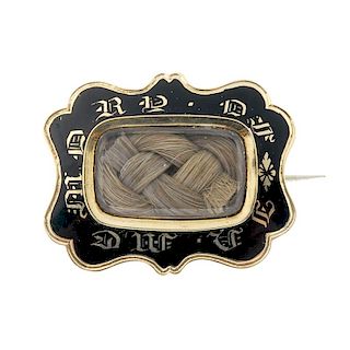 A late 19th century gold enamel mourning brooch. The rectangular-shape woven hair panel, within a bl