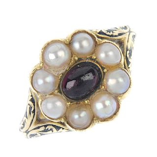 An early 19th century 18ct gold memorial ring. Designed as a central oval-shape cabochon garnet, wit