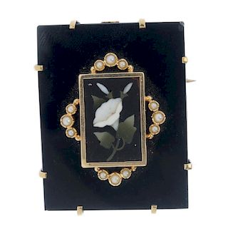 A late 19th century onyx pietra dura gold and split pearl brooch. Designed as a rectangular block of