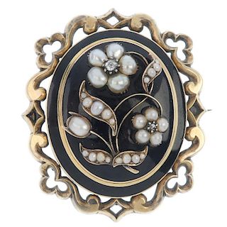 A mid Victorian gold, enamel, split pearl and diamond memorial brooch. The central black enamel oval