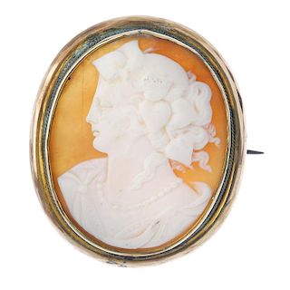 A cameo brooch. The oval-shape shell, carved to depict a lady in profile, to the rope-twist surround