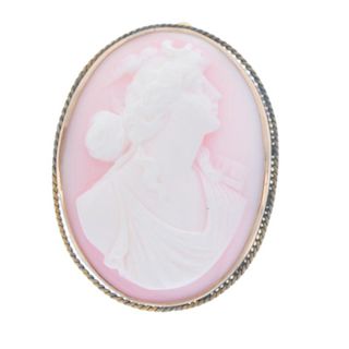 A cameo brooch. The pink shell carved to depict the Goddess Diana, to the rope-twist surround. Lengt