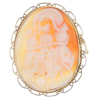 A cameo brooch. The shell carved to depict the Three Graces, dancing with linked arms, to the rope-t