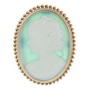 A cameo brooch. The green chalcedony cameo depicting a bacchante, to the rope-twist surround. Length