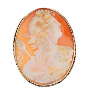 A 9ct gold cameo brooch. The oval-shape cameo carved to depict the God Dionysus, armed with a thyrsu