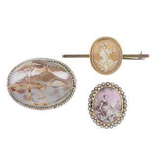 Three cameo brooches. To include an oval cameo depicting Pompeii with volcano erupting to the backgr
